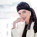 woman-wearing-black-chemo-cap-with-black-scarf-red-circles-sq