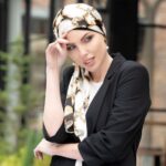woman-wearing-chemo-scarf-black-white-gold-sq